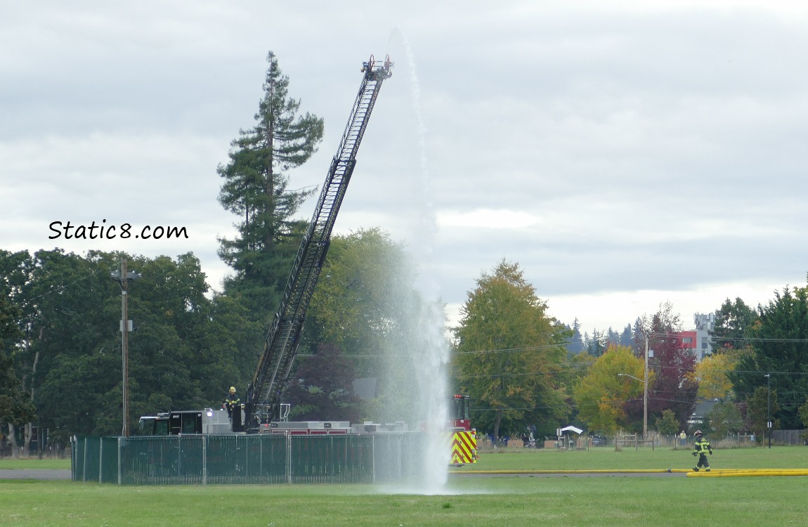 Fire truck ladder up and spraying water!
