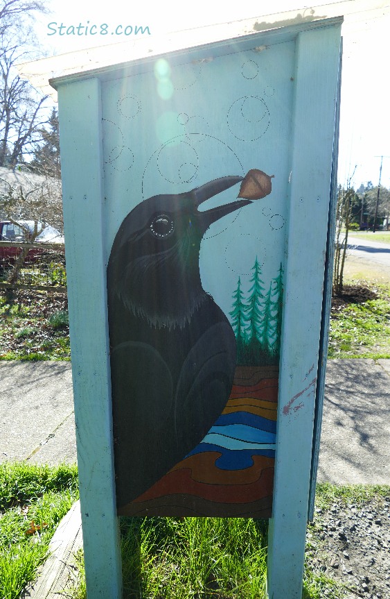 Crow art on the side of a Little Free Pantry