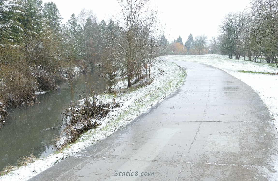 snow along the bike path and creek