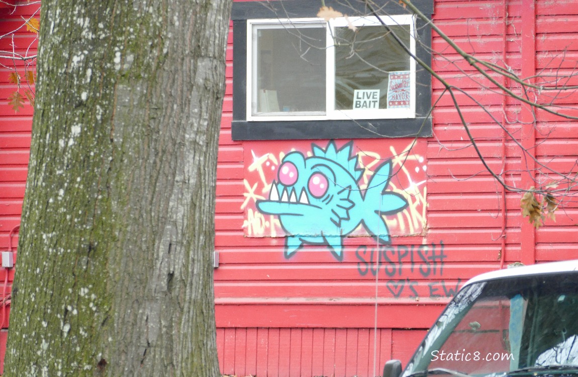 Graffiti fish on a red building