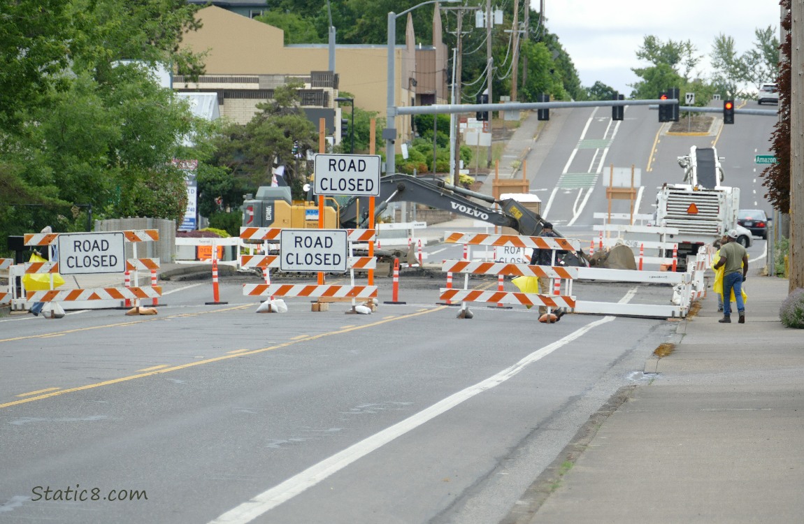 Road closed barriers across a street
