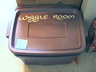 Our worm bin, labeled with white vinyl stickers!
