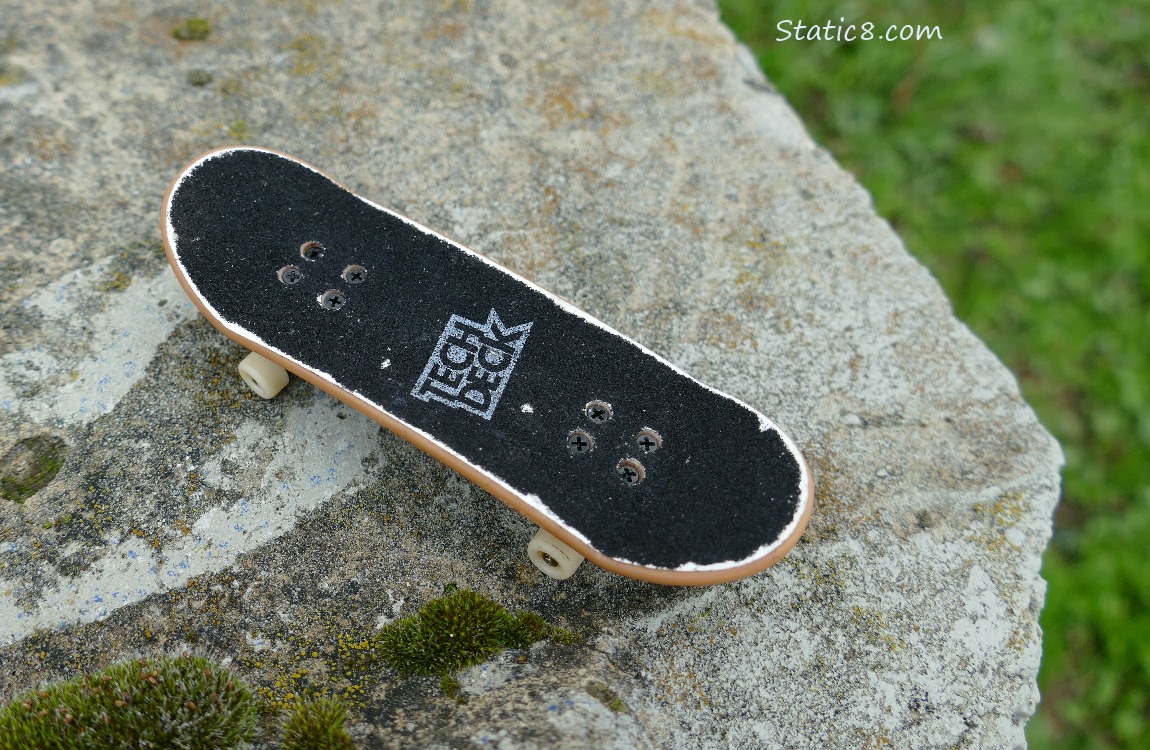 miniature skateboard on a concrete block