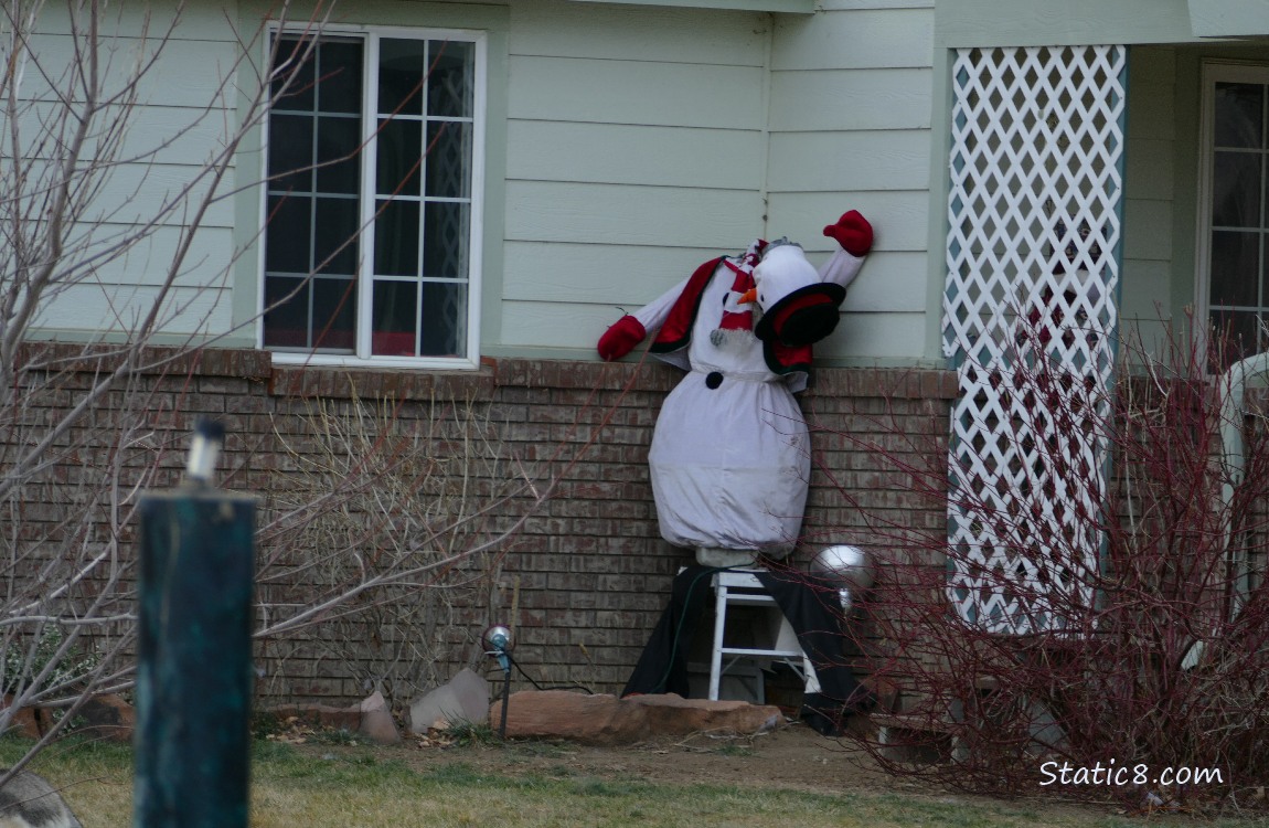 Snowman decoration with head drooping