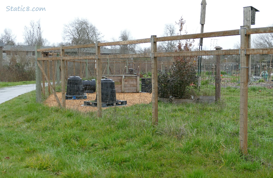 Community Garden behind a wood and wire fence