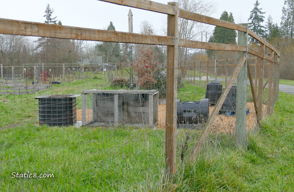Community Garden behind a wood and wire fence