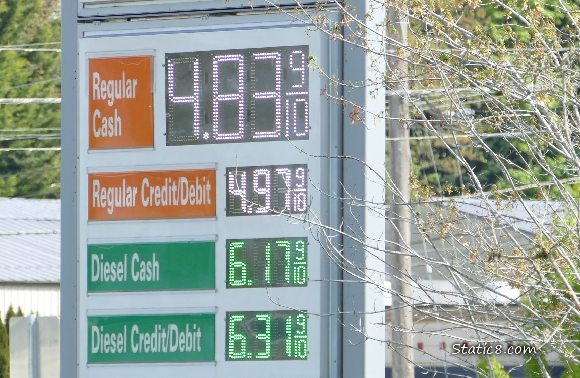 Price of gas on a display sign is $4.839 per gallon