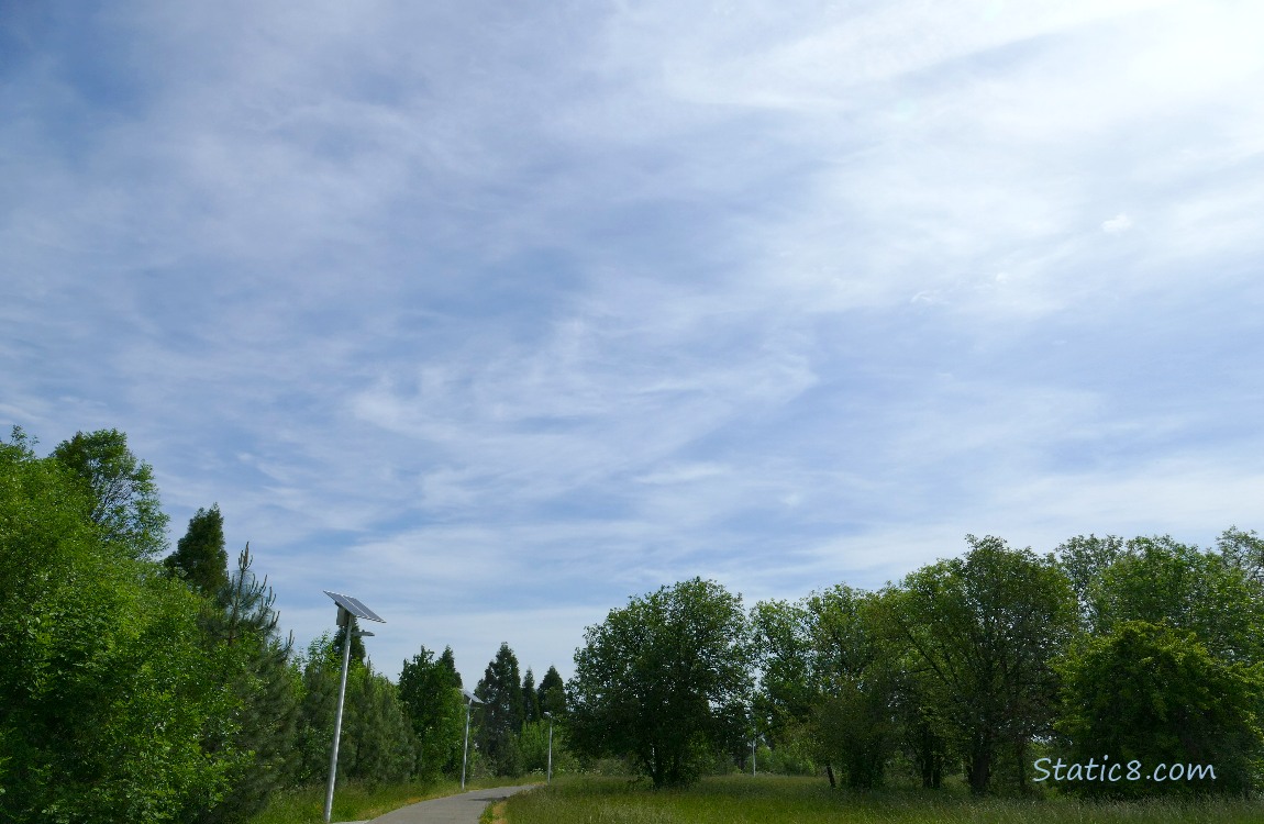 Blue sky with high clouds over the bike path