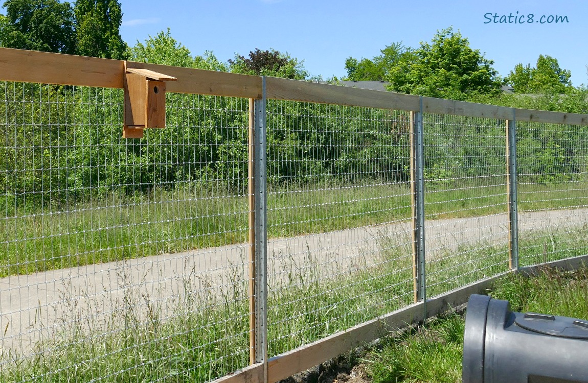 nest box on a wood and wire fence