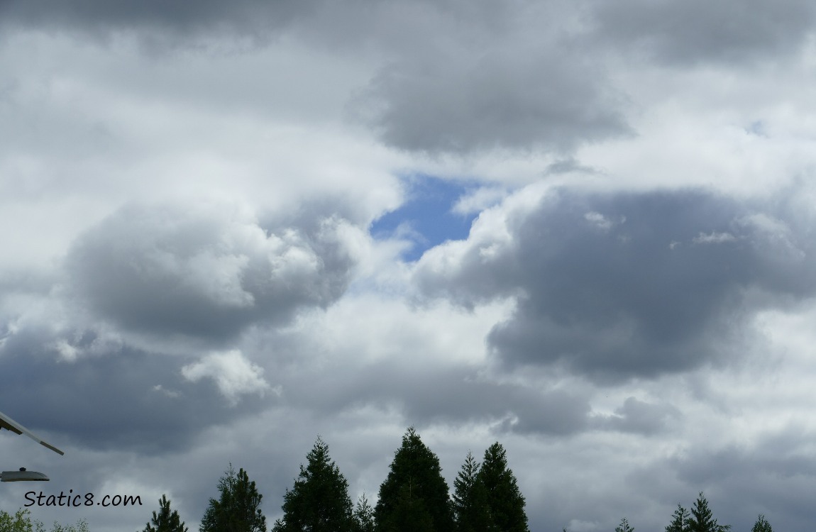 Clouds with a break of blue sky