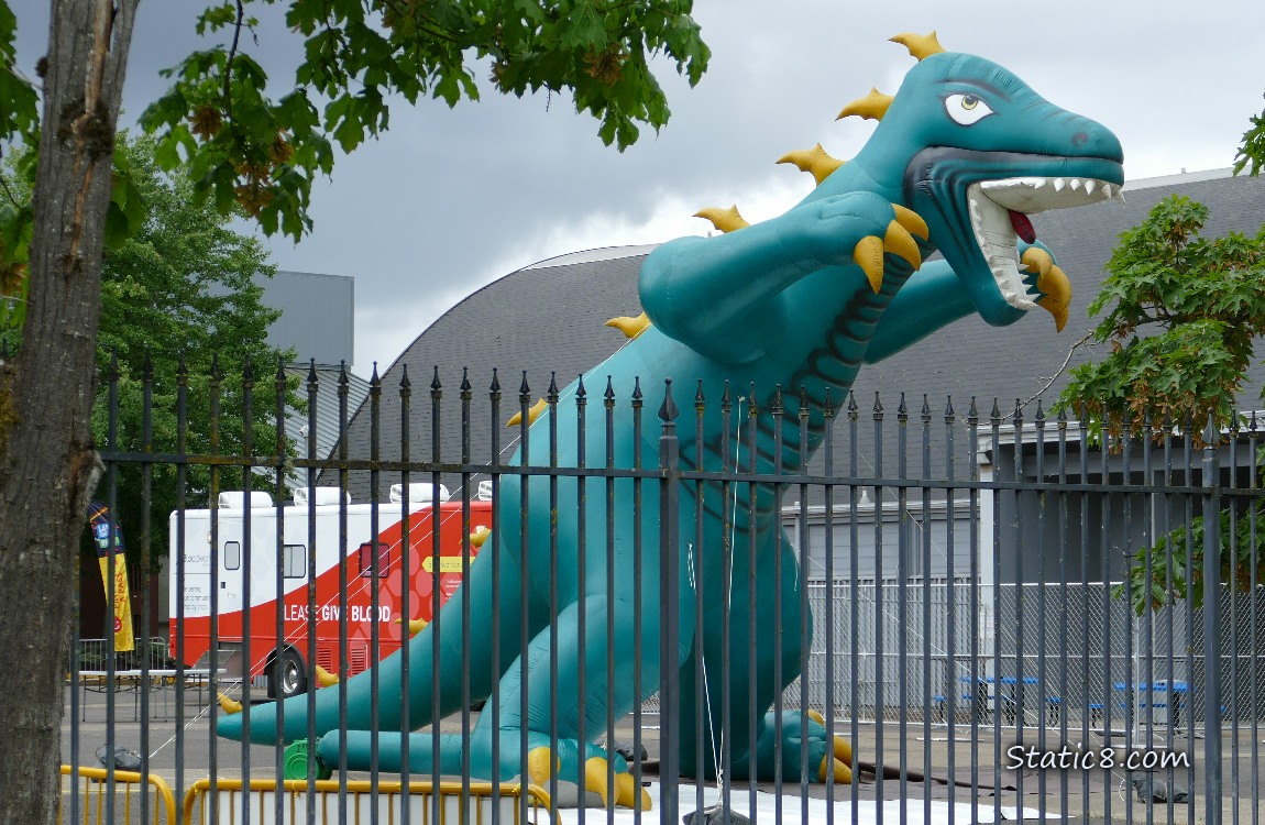 Blood Mobile next to a large inflatable t-rex