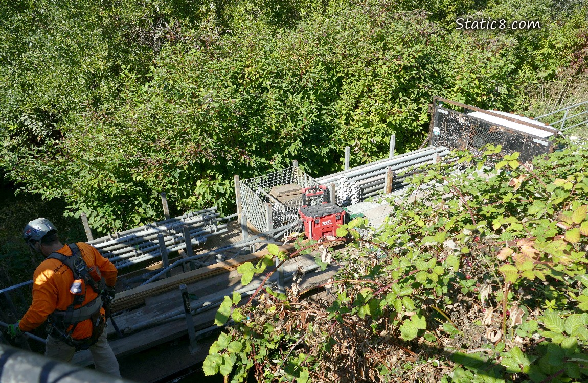 Looking down at a truck from a bridge