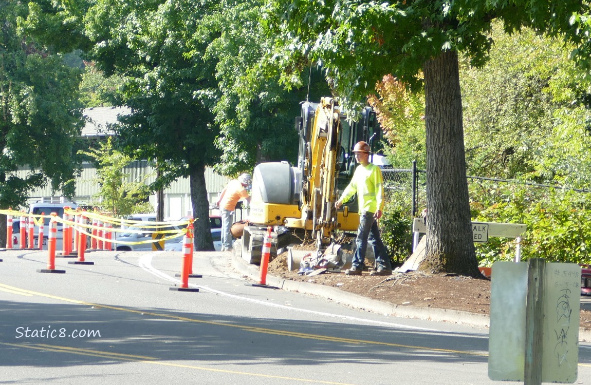 traffic cones and machinery on a city stree