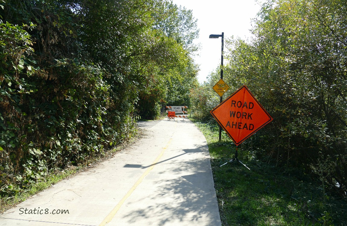 Construction signs along a path